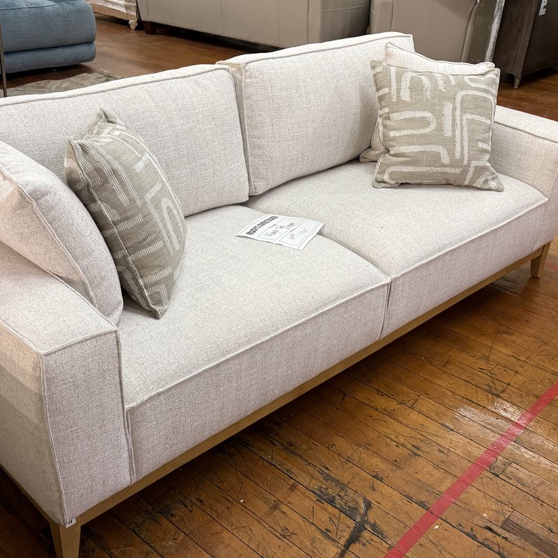 Cream fabric sofa on the store floor